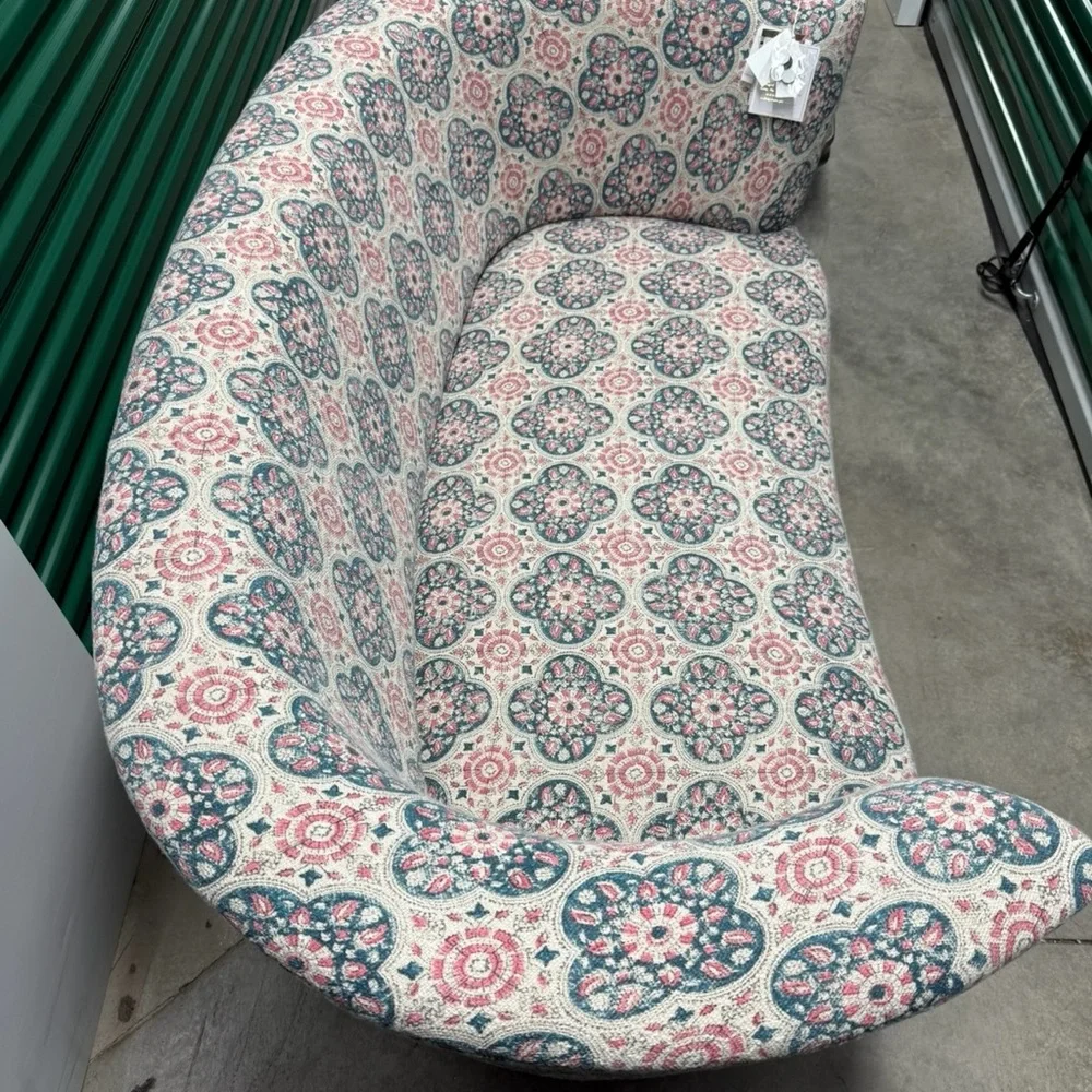 Elegant Patterned Sofa with Pink and Blue Accents